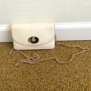 Coach small crossbody in cream leather.